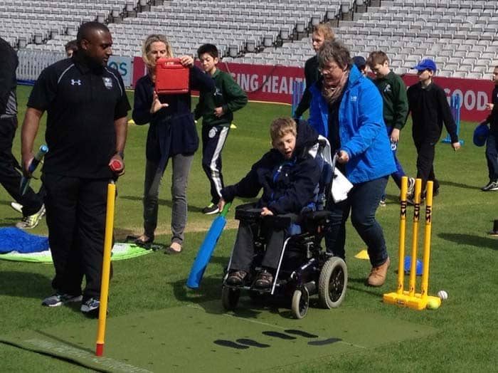 Disabled cricket practice with Cricket coaching and batting mat